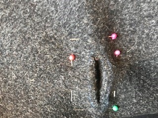 Buttonholes hand sewn as part of attaching the lining