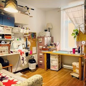 This image has an empty alt attribute; its file name is her-sewing-space.jpg